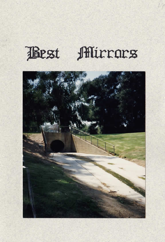 The cover of the zine Best Mirrors - a photograph of the drainage tunnel entrance