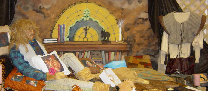 Bubba sprawled out on the bed; behind him a painting on canvas of Vincent's window