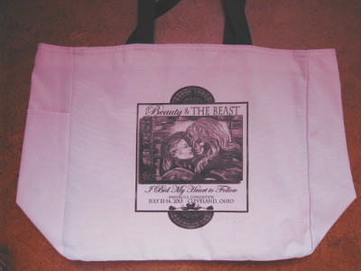 light pink canvas & vinyl bag with con logo
