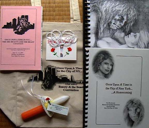 a collection of Once Upon a Time items: tote bag, program, name badge, candle, conzine, another zine